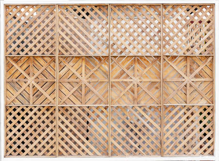 old wood fence with classic rattan for backgroundの写真素材