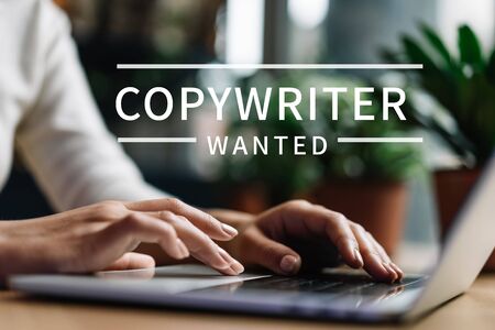 Freelancer copywriter using laptop, typing on keyboard, edit something, working from home
