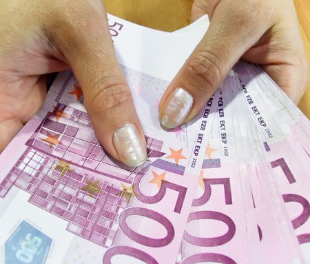 Banknotes 500 euros in a female hand