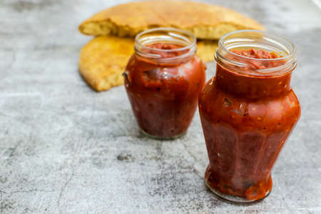 Dish of minced peppers, tomatoes and spices, cooked to a pulp - bulgarian traditional lutenitsaの写真素材
