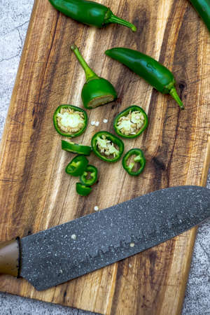 Ingredients for marinated hot peppers and jalapeno peppers in a jar
