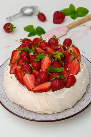 Homemade cake Pavlova with strawberries on top - sweet foodの写真素材