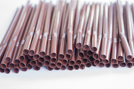 Plastic drinking straw on white backgroundの写真素材