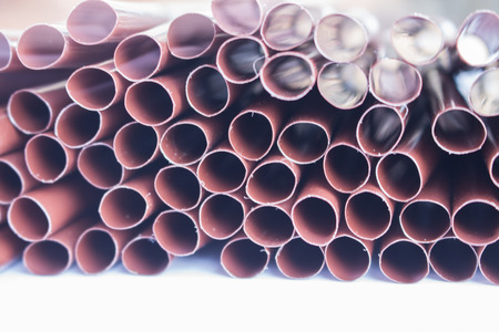 Plastic drinking straw on white backgroundの写真素材