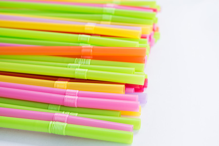 Plastic drinking straw on white backgroundの写真素材
