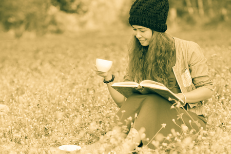 Beautiful women drinking in the gardenの写真素材