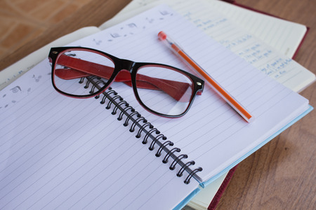 Student note book on wooden table, do homework