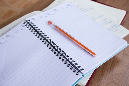 Student note book on wooden table, do homeworkの写真素材