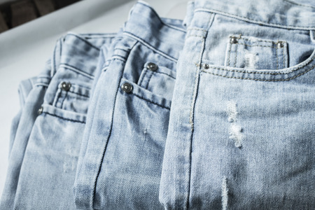 Stack of denim jeans