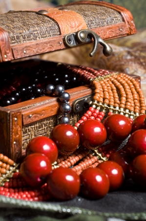 Close-up old jewelery chest with necklaces placed on scarves  Many necklace inside の写真素材