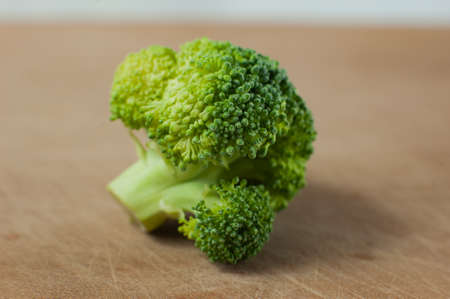 Broccoli on a wooden Board . Vegetables close-up. Macro photo.の写真素材