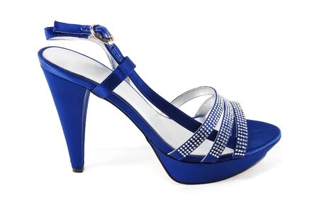 elegant female sandals on a high heel are isolated on a white backgroundの写真素材
