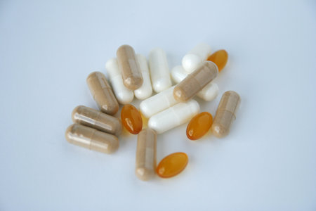Pills and capsules on a white background. close-up.