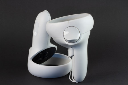 White vr controller on black background.