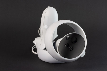 White vr controller on black background.