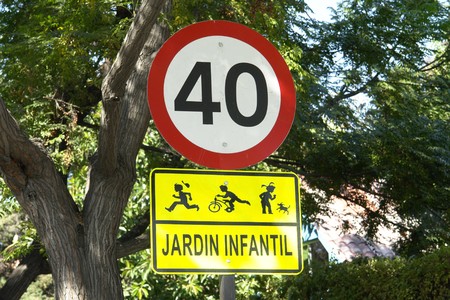 Sign signal speed and school children.                               