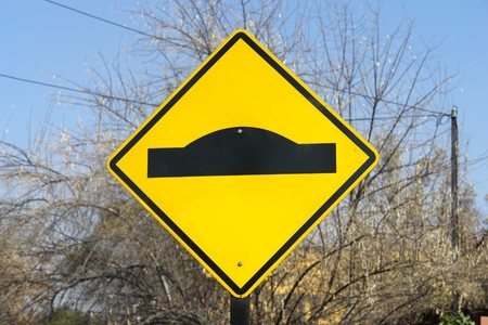 Traffic sign, loin of bull to reduce speedの写真素材