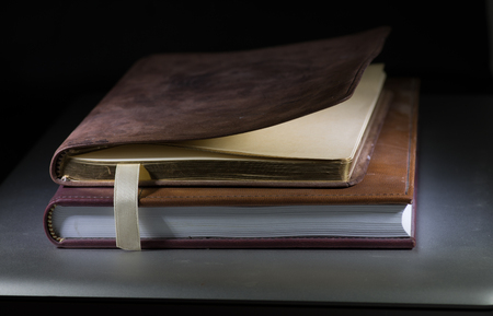 Journal, book, and laptop close upの写真素材