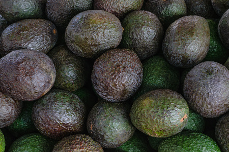 Ripe and unripe avocados