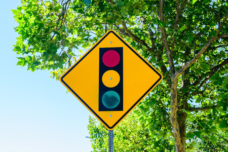 Traffic sign with trees in backgroundの写真素材