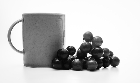 Coffee and grapes in black and whiteの写真素材