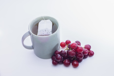 Green tea and grapesの写真素材