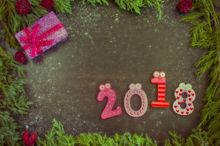 New Year composition with fir-trees, cones and candlesの写真素材