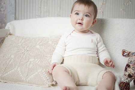 A small child in natural tissue diapers, eco-friendly cotton diapersの写真素材