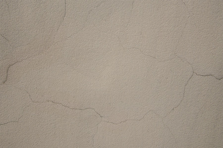 Texture of a wall with cracked plasterの写真素材