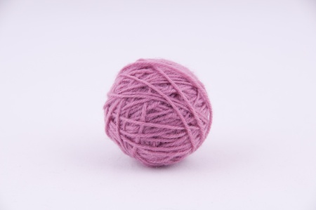 A ball of yarn for knitting on a grey backgroundの写真素材