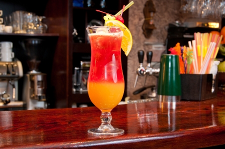 Tequila Sunrise cocktail at the bar の写真素材