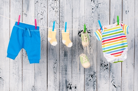 Baby clothes hanging on the clothesline.の写真素材