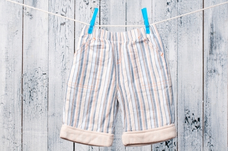 Baby clothes hanging on the clothesline.の写真素材