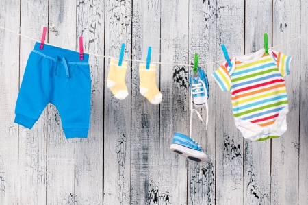 Baby clothes hanging on the clothesline.の写真素材