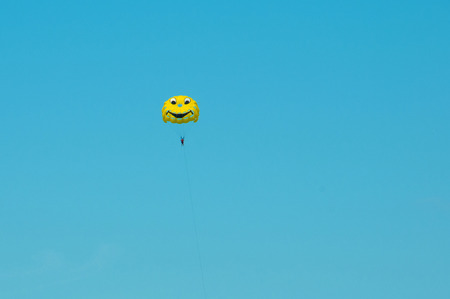 Cheerful parachute like a smile. Paragliding in Turkey.の写真素材