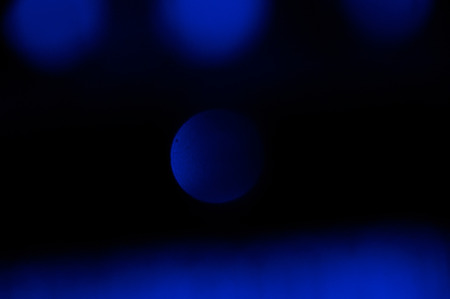 Blue abstract bokeh background with vertical stripes blurred
