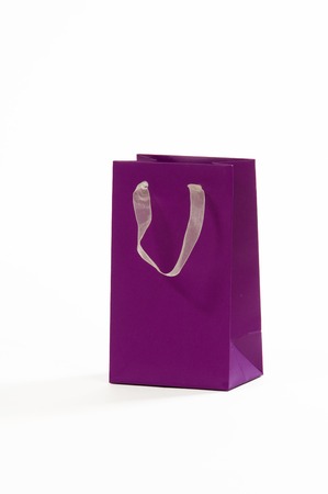 Purple paper bag on a white backgroundの写真素材
