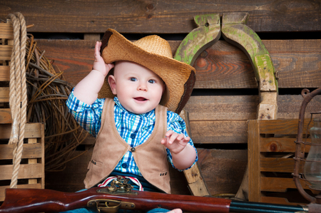 Portrait of a small boy in cowboy decorの写真素材