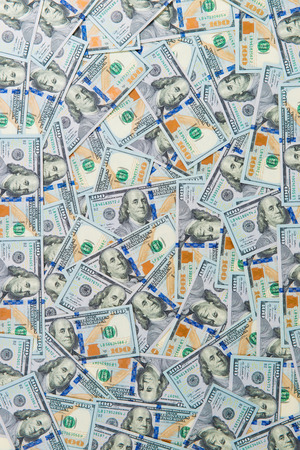 Background from scattered dollar banknotes as abstract seamless.の写真素材