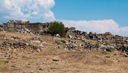 Ruins and old buildings in Hierapolis ancient city adjacent to modern Pamukkale in Turkey.の写真素材