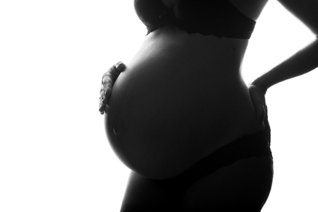 silhouette of Pregnant woman on a white background.の写真素材