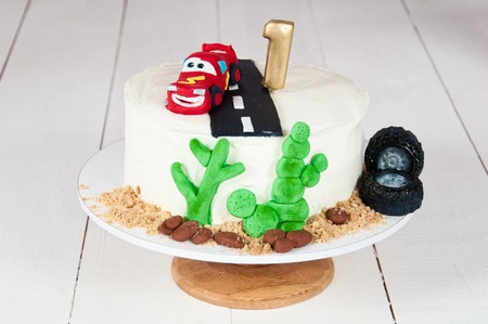 Festive cake with a birthday car for 1 year.の写真素材