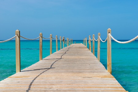 Wooden bridge over the sea. Travel and Vacation. Freedom Concept.の写真素材