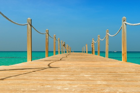 Wooden bridge over the sea. Travel and Vacation. Freedom Concept.の写真素材