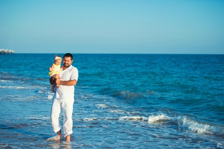 Happy father playing with cute little daughter at the beach. Rest in Turkeyの写真素材