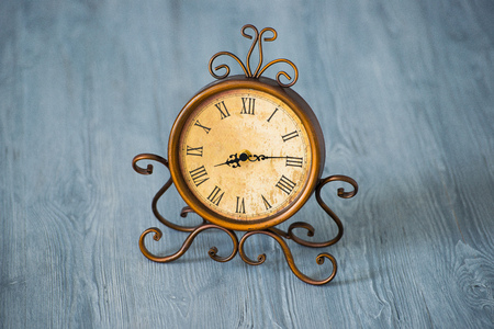 Vintage and old clock on wood background