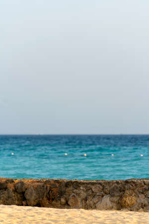 Sea and sandy shore with a fence. beautiful sea horizon. high quality photoの写真素材