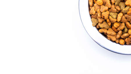 Round metal bowl for pets with dry food. isolated on white background. view from above. Part of a...