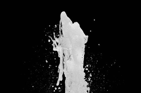 water splash isolated on the black backgroundの写真素材