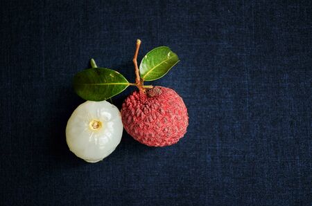 Fresh fruit Lychee on clothing background, top view photo, copy space for text